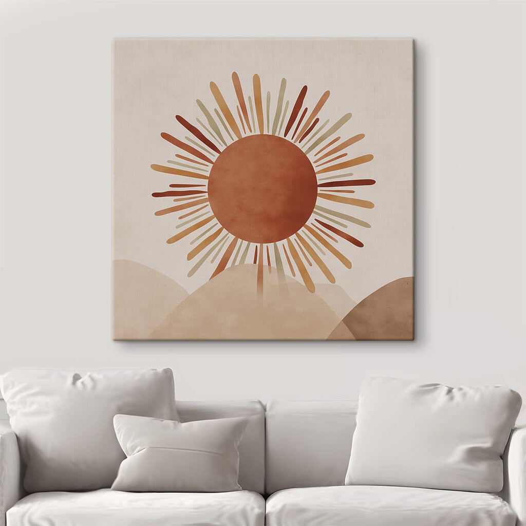 Sun with rays coming out of the top of a hill